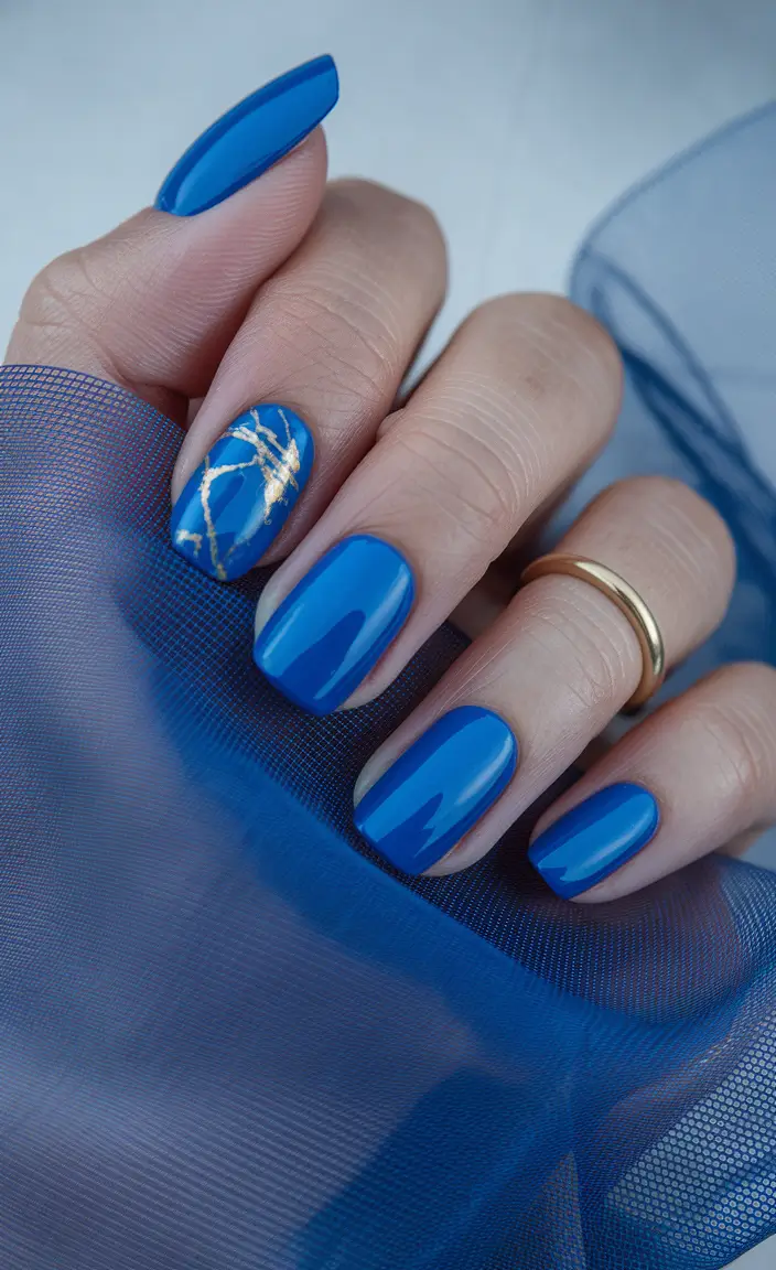 fall manicure 2025 Royal Blue with Gold Veins