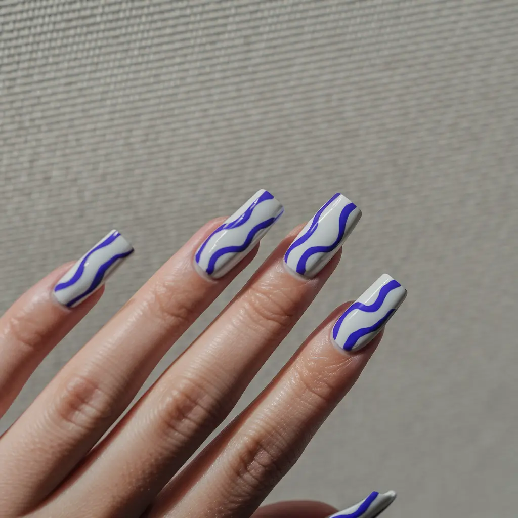 fall nails art 2025 Wavy Blue on Neutral Base