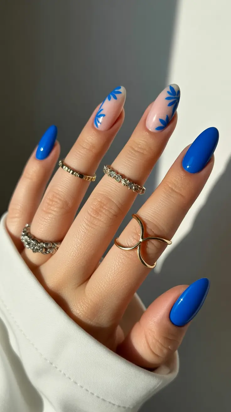 blue nails trend 2026 Blue Botanical Accents With Glossy Cobalt