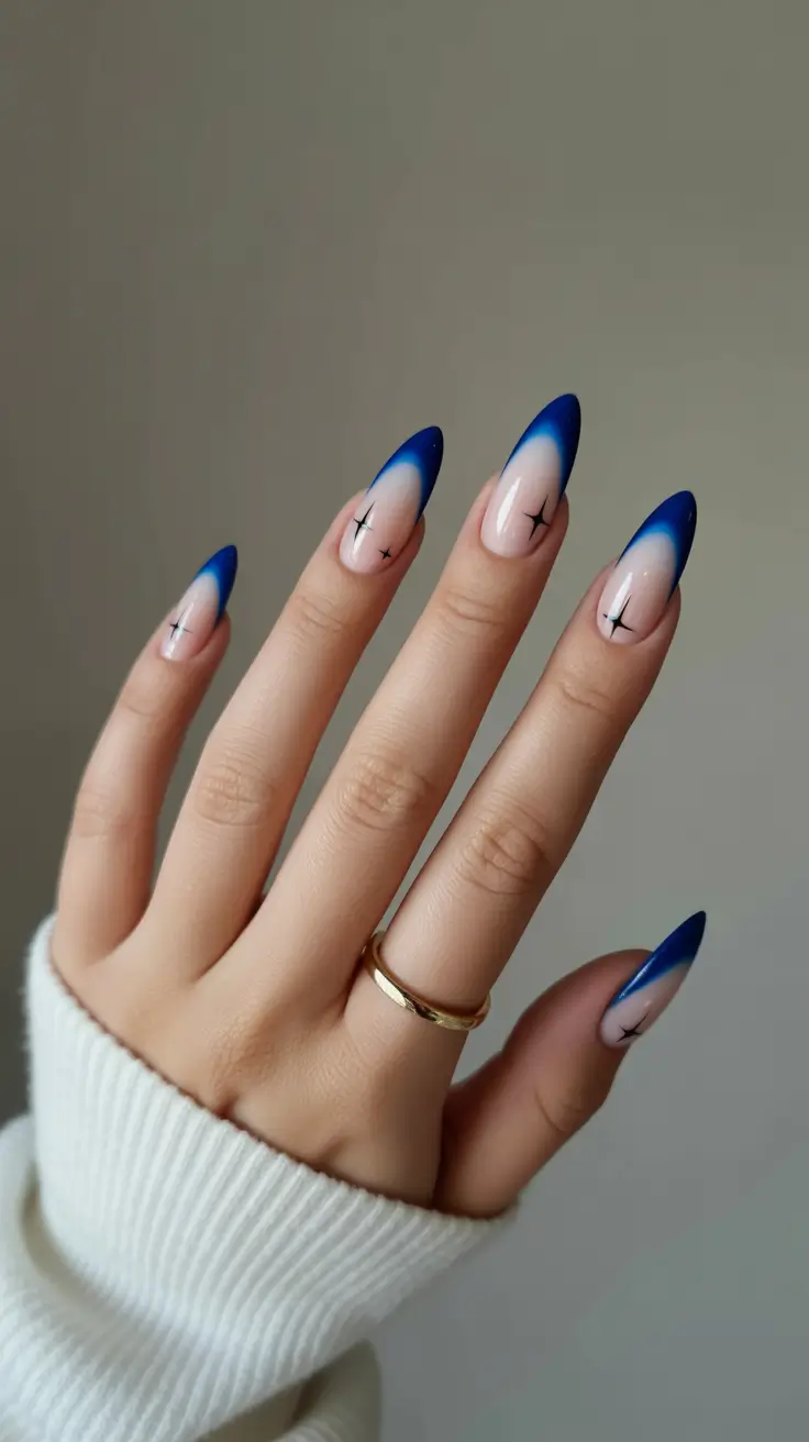 blue nails trend 2026 Deep Blue Aura Tips With Star Accents