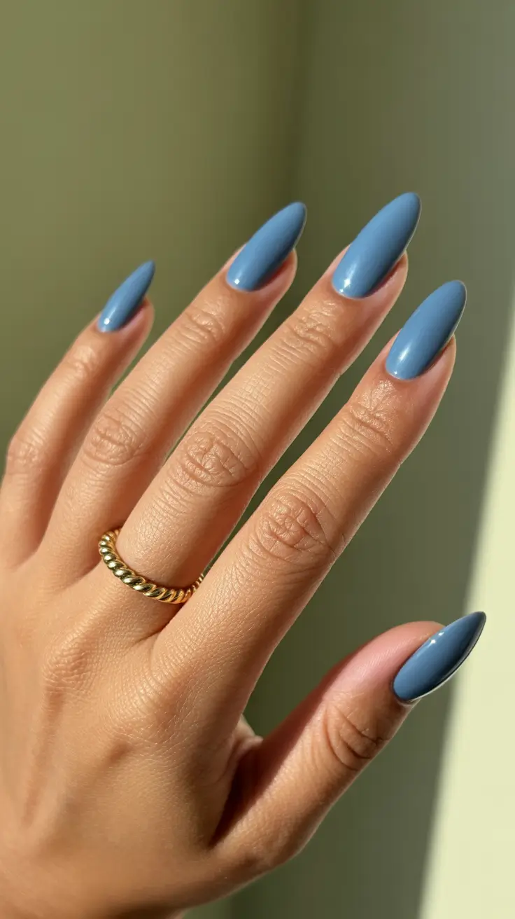 Blue nails trend 2026 Elegant Smoky Blue Almond