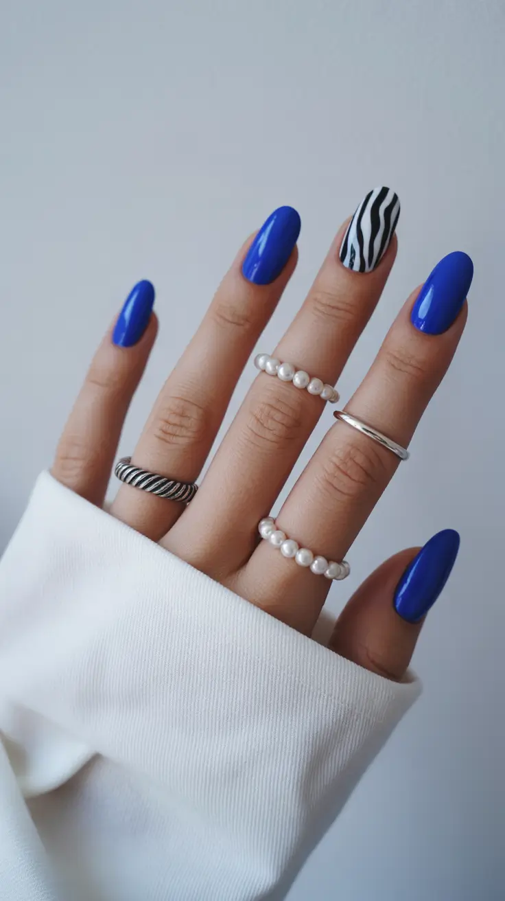 blue nails trend 2026 Vivid Cobalt With a Monochrome Accent