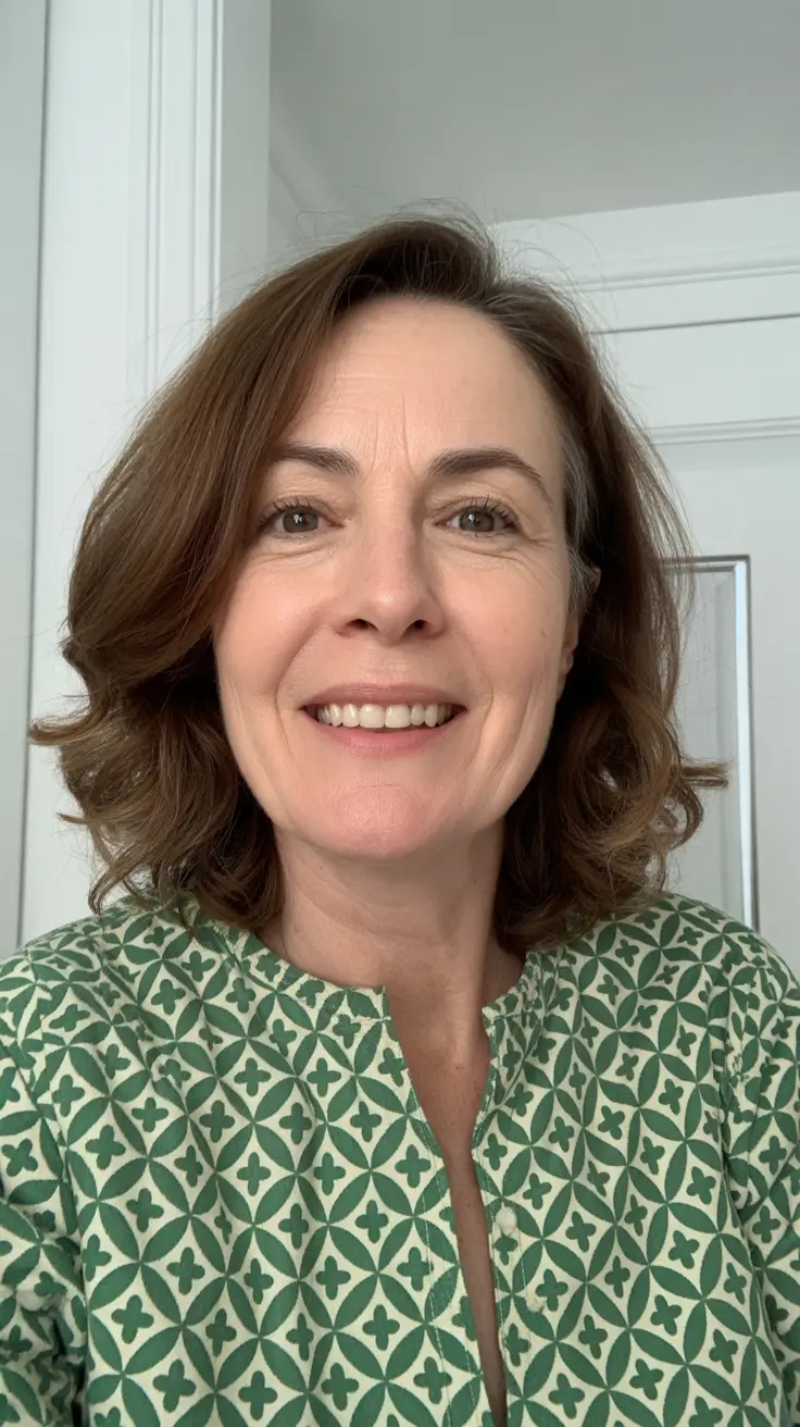 Modern haircuts for women over 40 2026 Medium Layered Curls with Natural Warmth