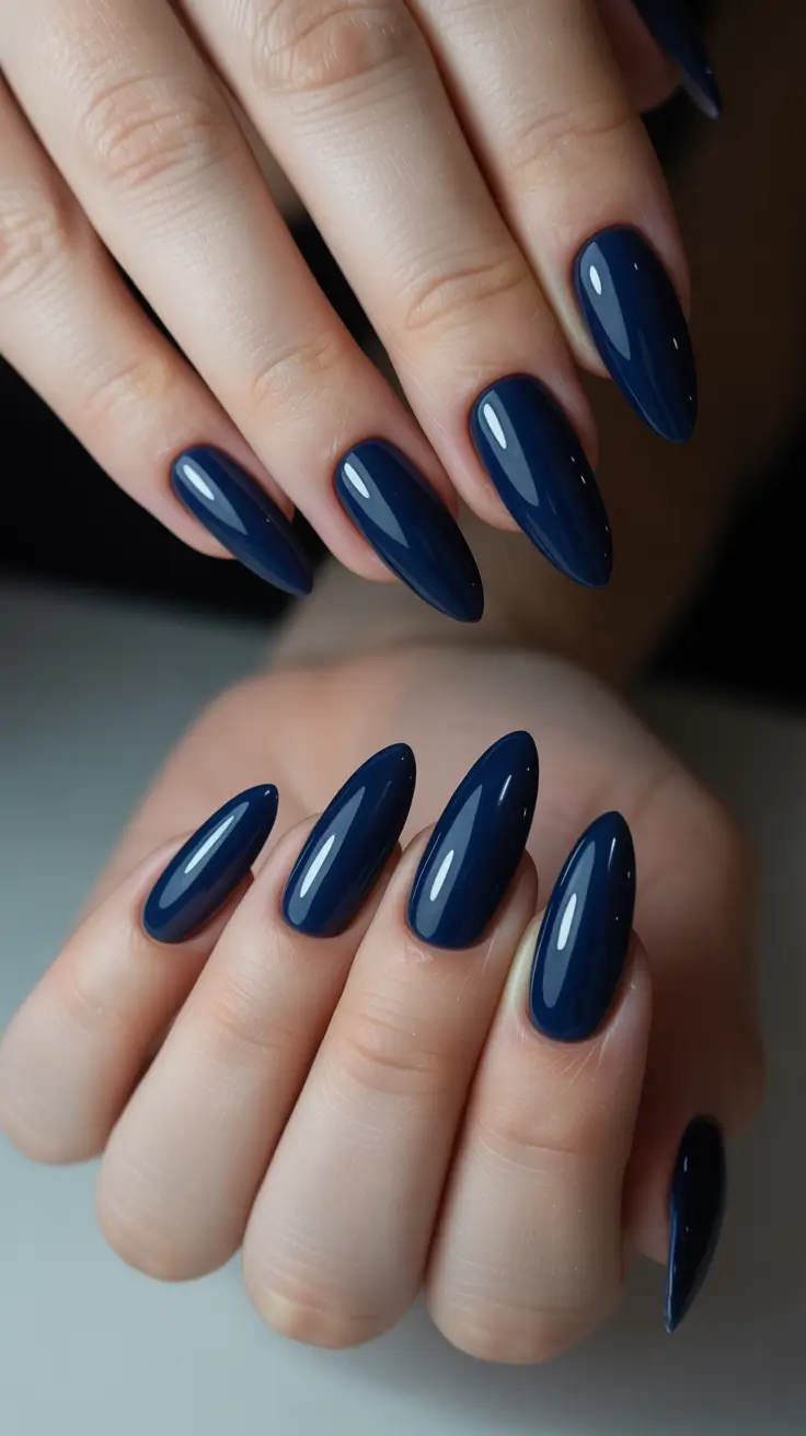 trendy acrylic nails 2026 Deep Midnight Almonds for Moody Elegance