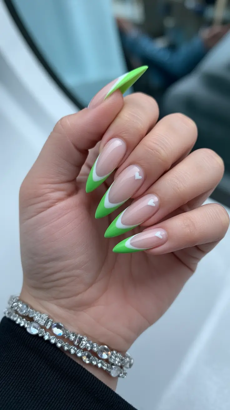trendy French nails 2026 Layered Green French With Tiny Heart Accents