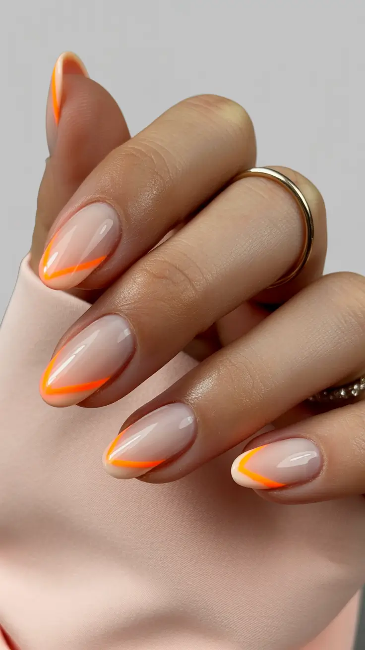 graduation nails ideas 2026 Minimal Neon Orange French for a Modern Graduation Twist