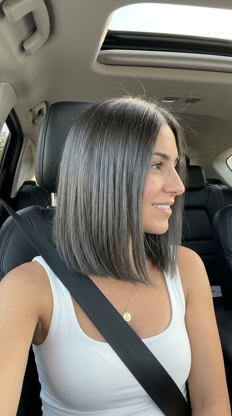 collarbone-length ashy brunette blunt lob haircut with a clean perimeter and internal point-cutting for a chic look