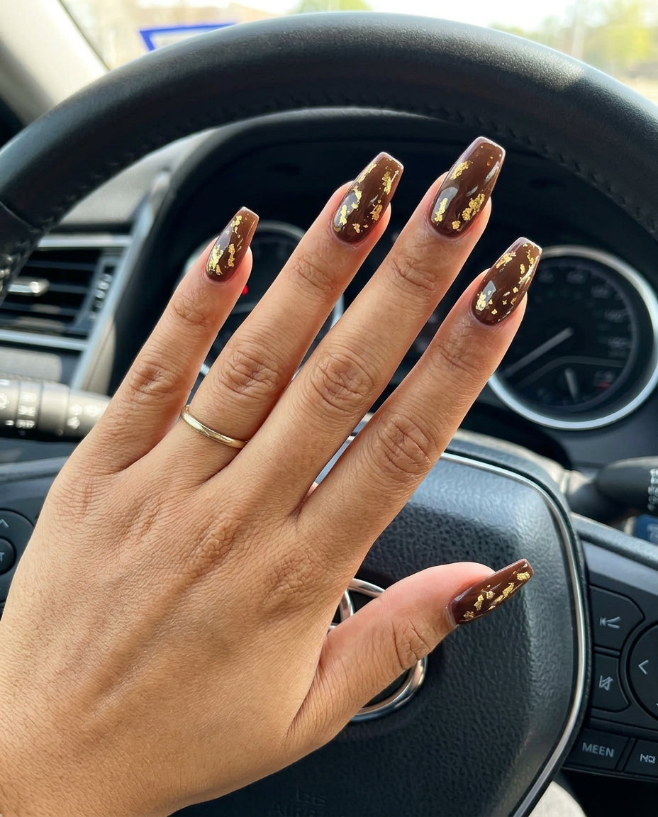 Gold Foil Nails 2026: Glamorous Summer Glamorous golden hour brown nails with metallic gold foil accents for colourful summer nails 2026. Luxurious and chic.