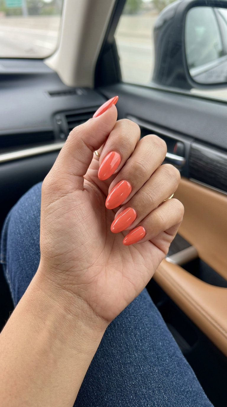 Tropical Coral Gloss Almond nails for july nails 2026: vibrant, bold vacation style.