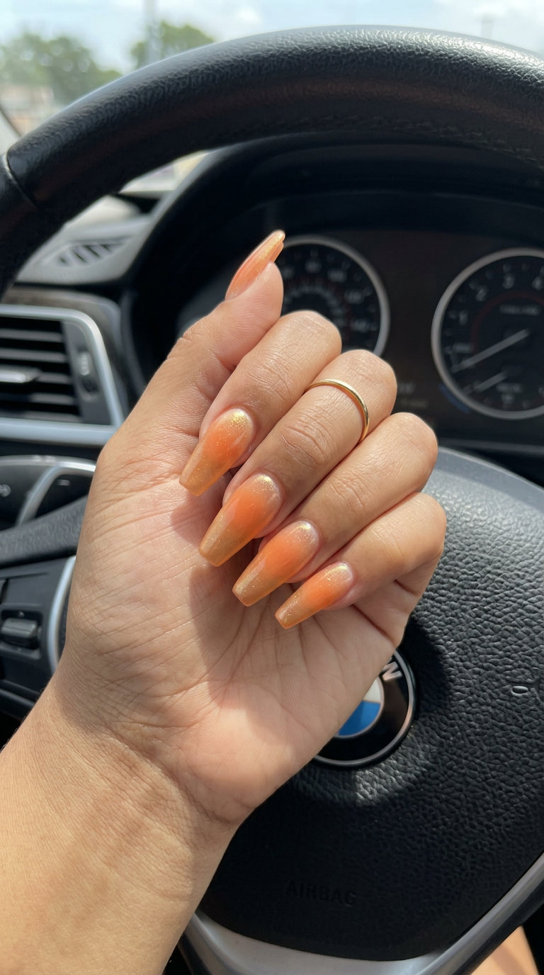 Sunset Aura Gradient Nails 2026 Sunset aura gradient nails with peach and gold shimmer for romantic summer evenings 2026.
