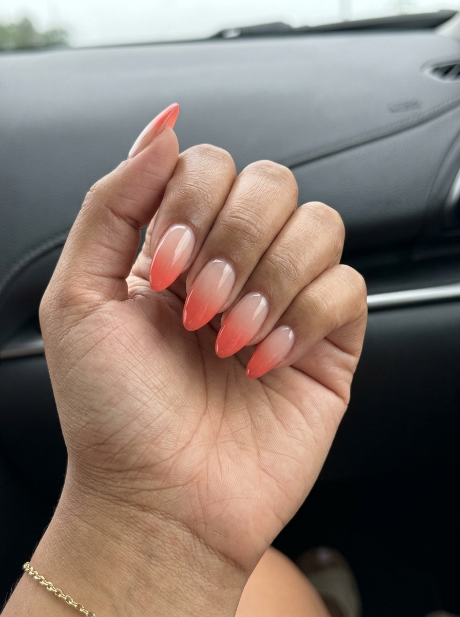 Sunset vivid coral ombre stiletto nails for glamorous summer travel 2026.