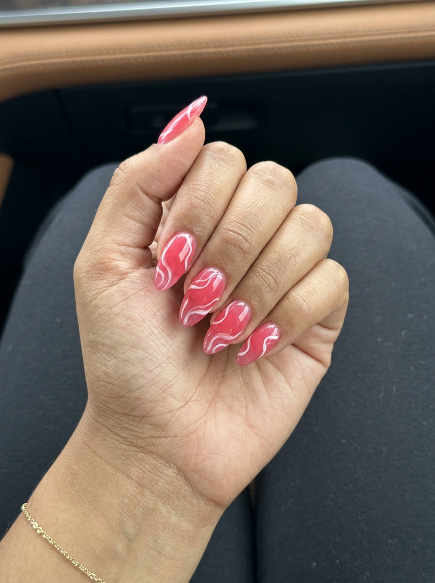 Watermelon pink jelly swirl nails for vacation or a beach day. Pink summer nails 2026.