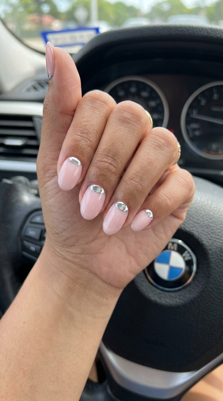 Short oval summer nails 2026: Milky Pink Chrome Half Moon for evening events. Chic silver accent.