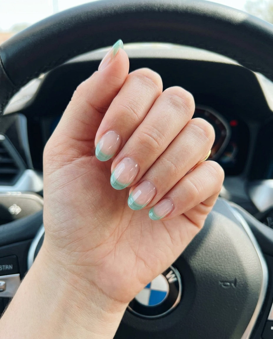 Short oval summer nails 2026: Seafoam green jelly micro French tips, sheer, transparent, glossy finish for vacation.