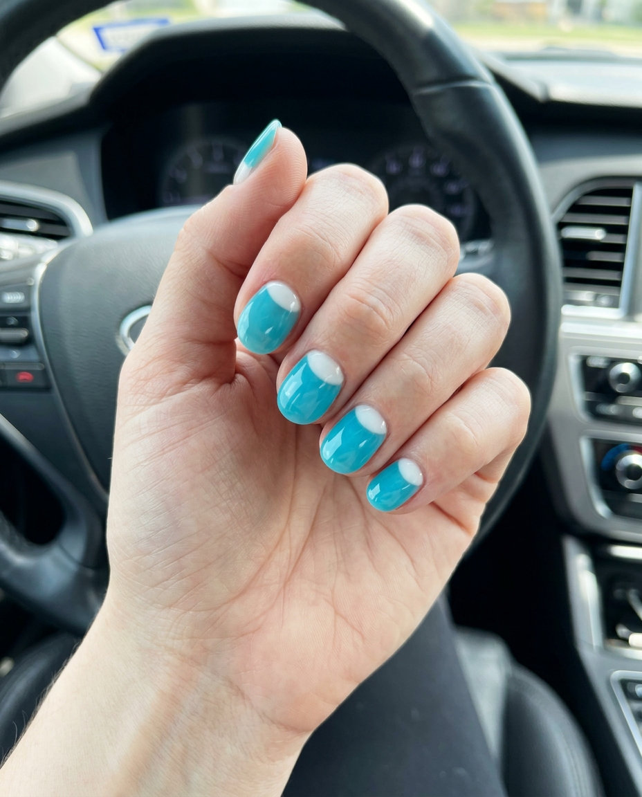 Aqua Jelly Reverse French Nails 2026: Playful Short Round Aqua Blue Jelly Reverse French: Short round summer nails 2026 with aqua jelly and white reverse French.
