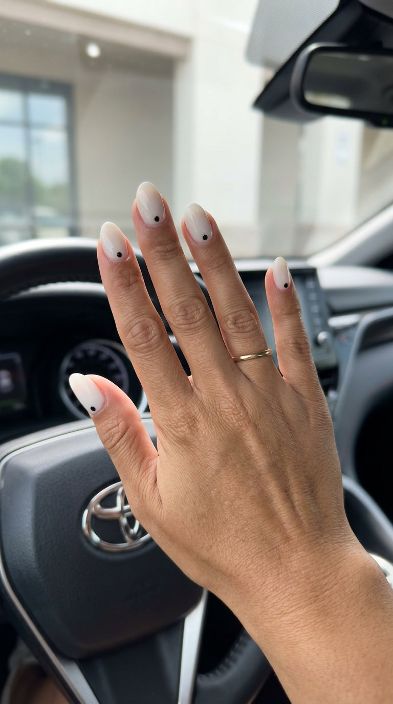 Milky White Dot Almond Nails 2026 Milky white single dot soft almond nails for simple short summer nails 2026. Minimalist and chic for office.
