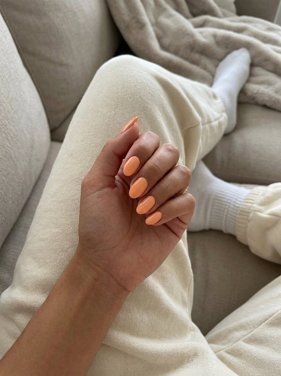 Peach Almond Nails 2026 | Sophisticated Style Warm peach almond nails with high gloss for date nights. Simple short summer nails 2026.