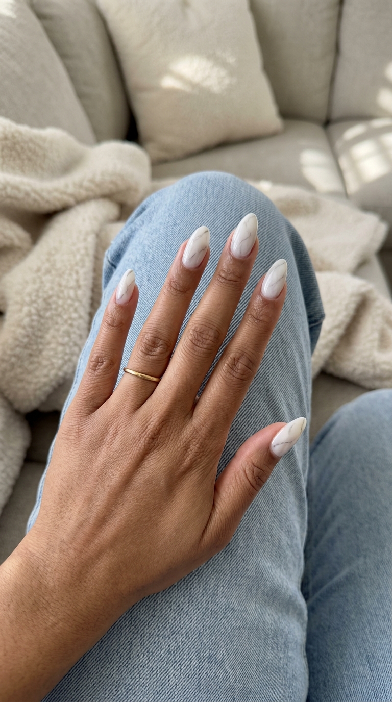 Sophisticated milky white marble almond nails for summer 2026 formal events. Elegant and artistic.