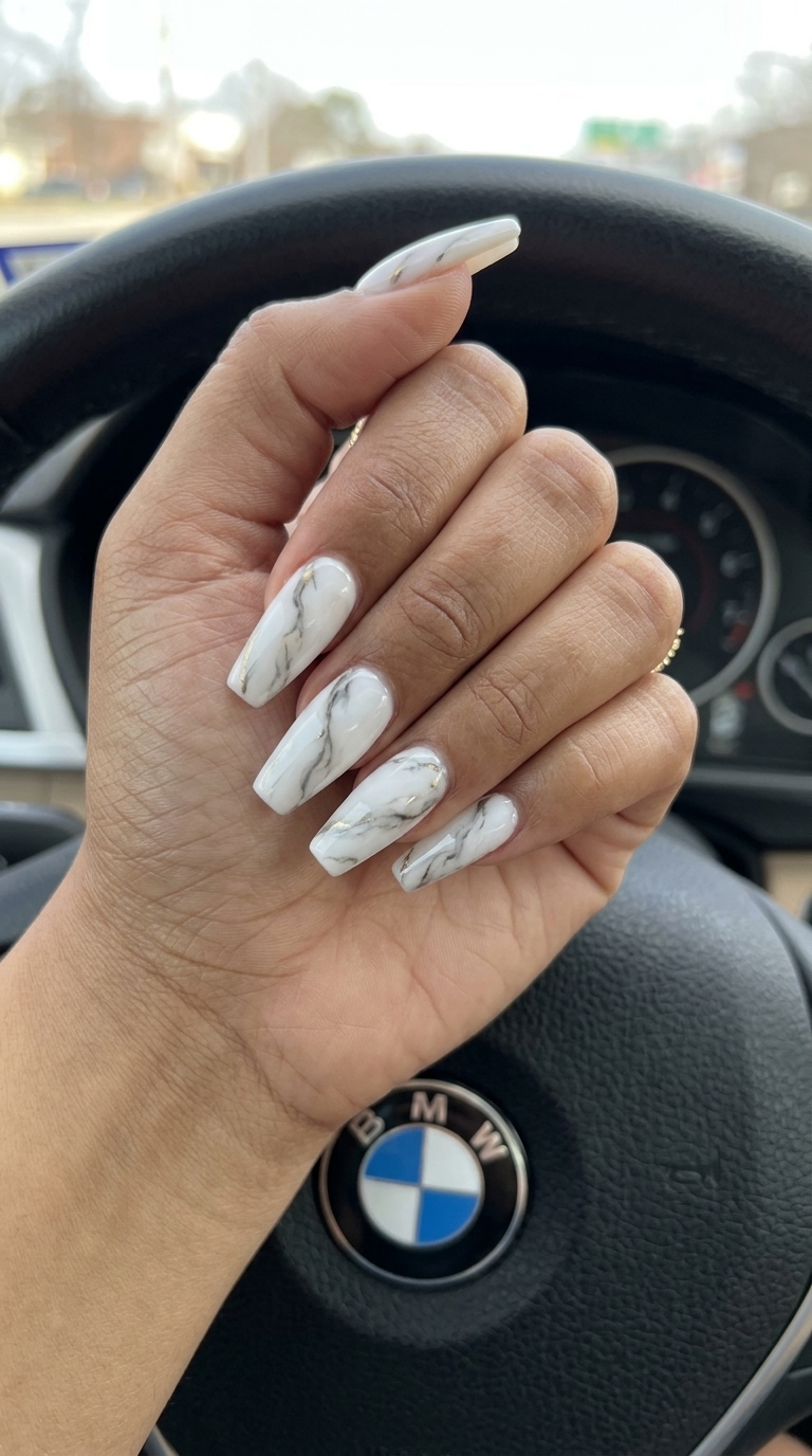 Milky Marble Nails 2026 | Glamorous Party Style Milky white marble swirl nails with gold accents for summer classy nails 2026, ideal for parties or formal events.