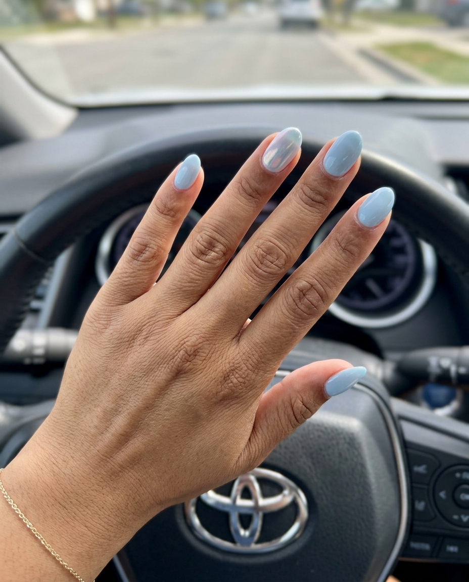 Pale Blue Chrome Accent: Summer Classy Nails 2026 Pale blue nails with a subtle iridescent chrome accent for trendy summer classy nails 2026. Perfect for vacation.