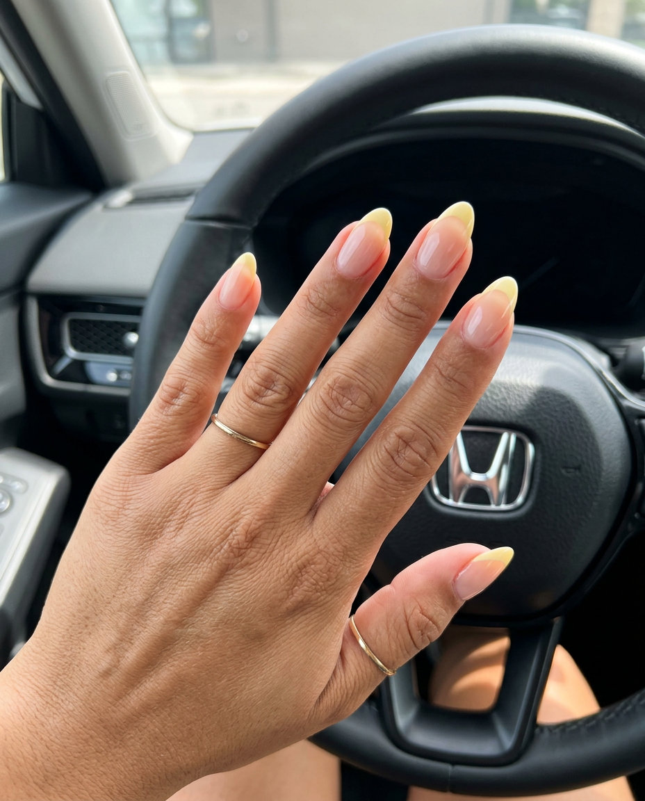 Trendy Summer Nails 2026: Butter Yellow Micro French Butter yellow micro French tips on almond nails for trendy summer nails 2026. Clean-girl casual & work chic.