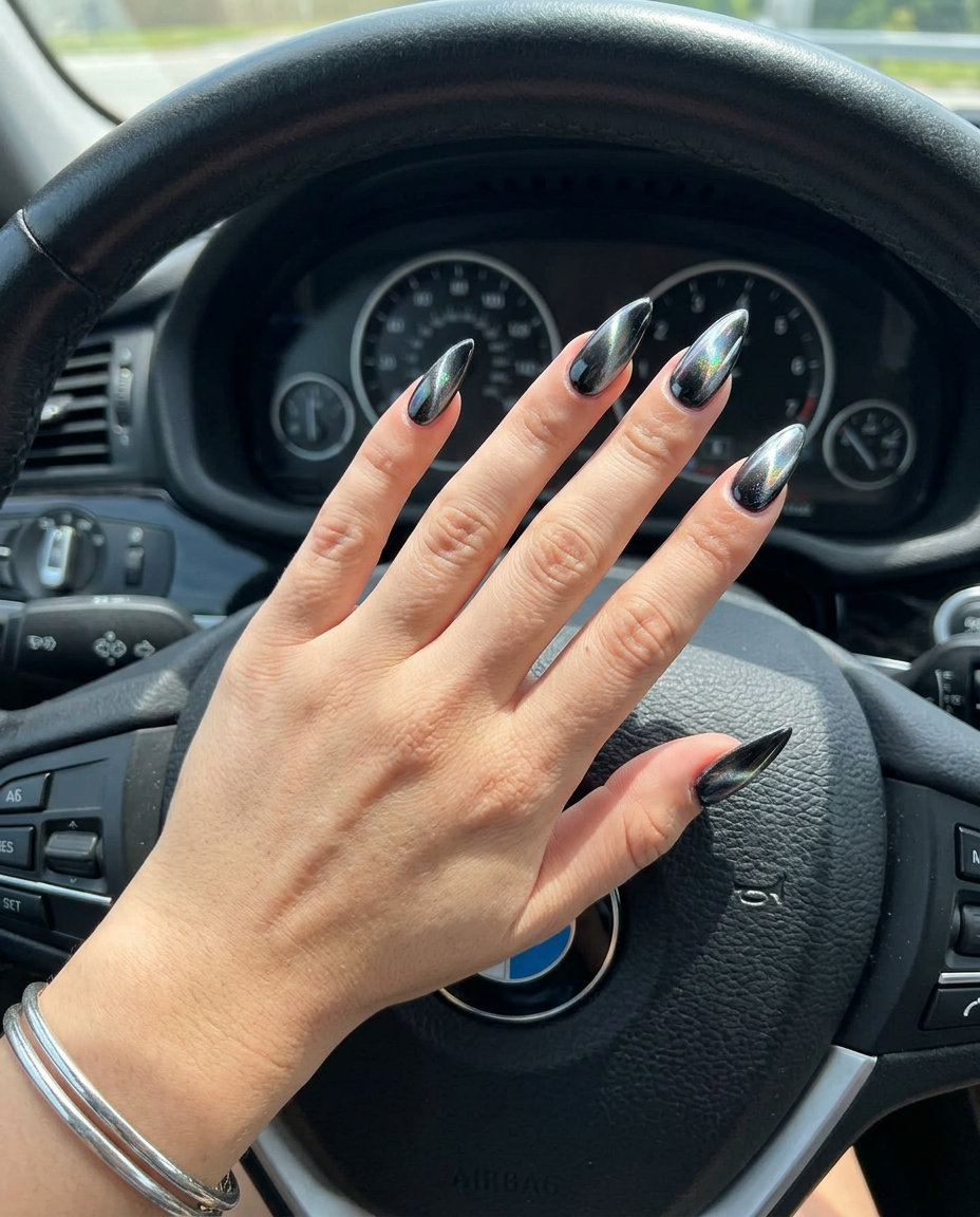 Cybernetic Cat Eye Vacation Nails 2026 Silver cat eye chrome stiletto nails for vacation 2026. Futuristic, edgy, perfect for parties.