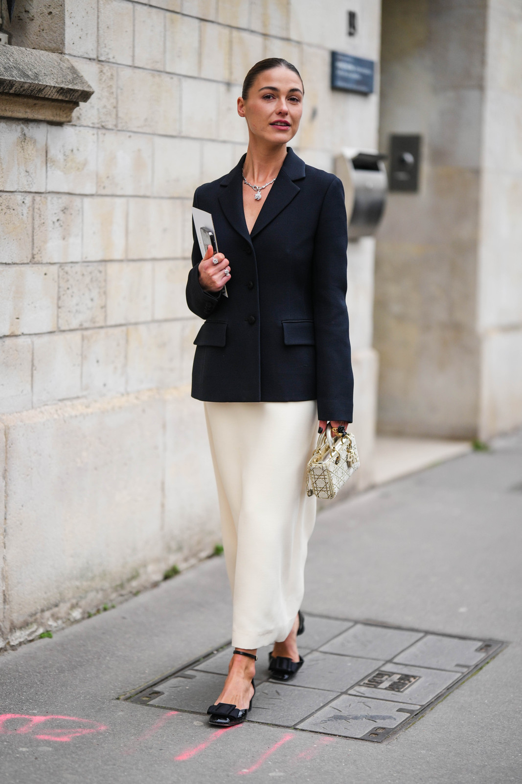 Camel Coat Over Black Top and White Leather Pants — French Girl Outfits 2027