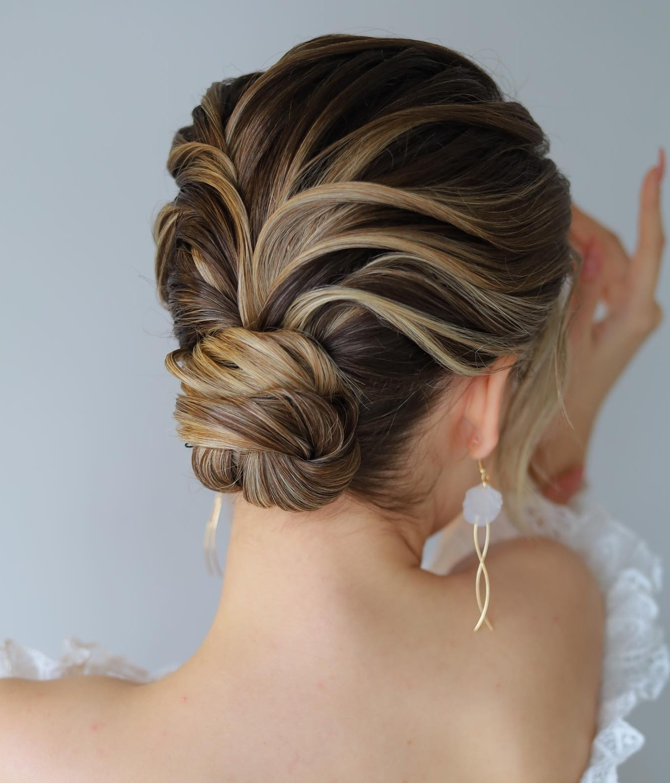 Twisted Dark Brown Low Bun — Bridesmaid Hairstyles 2027