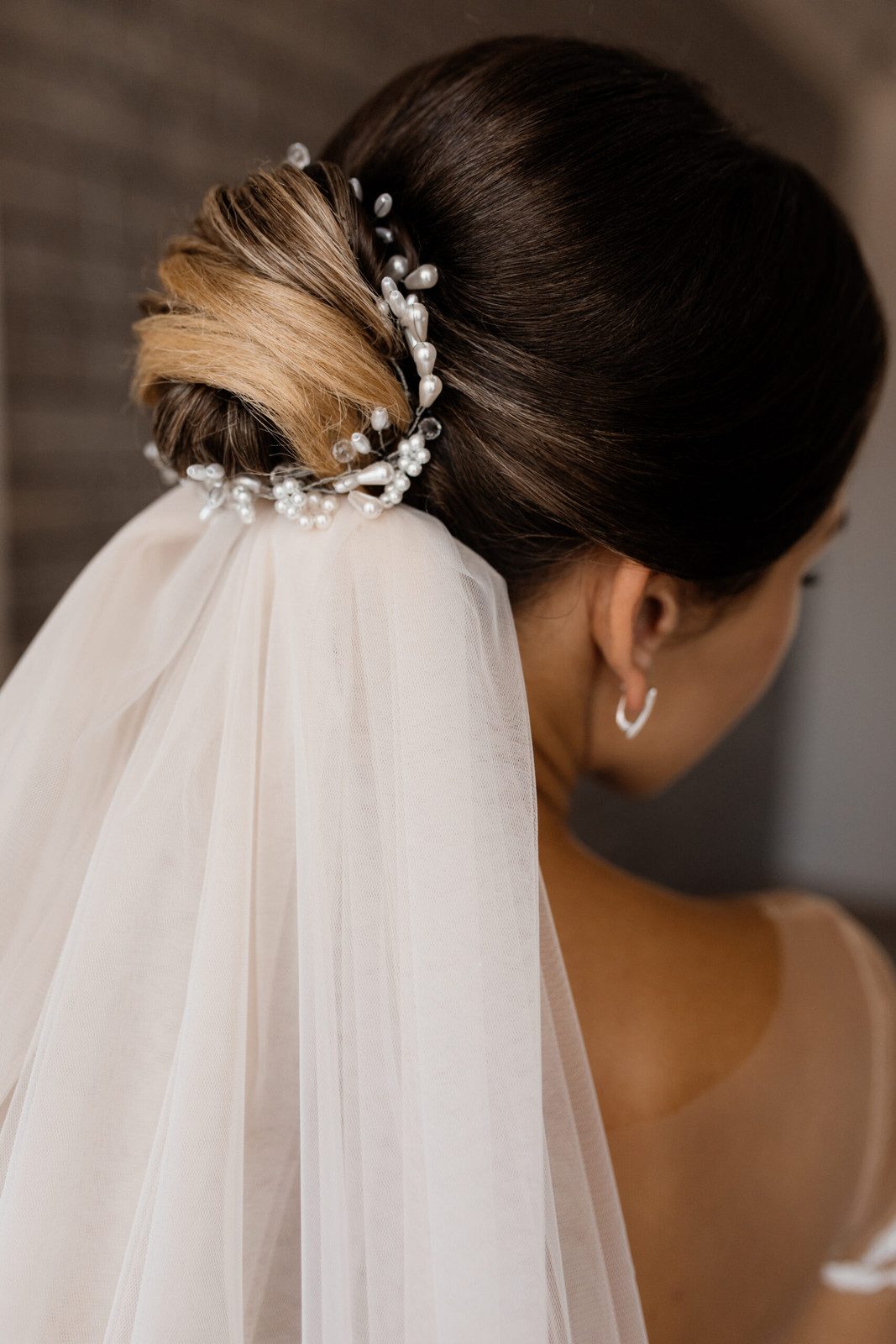 Elegant Dark Brown Bun with Pearls Elegant Dark Brown Bun with Pearls — Summer Buns 2027