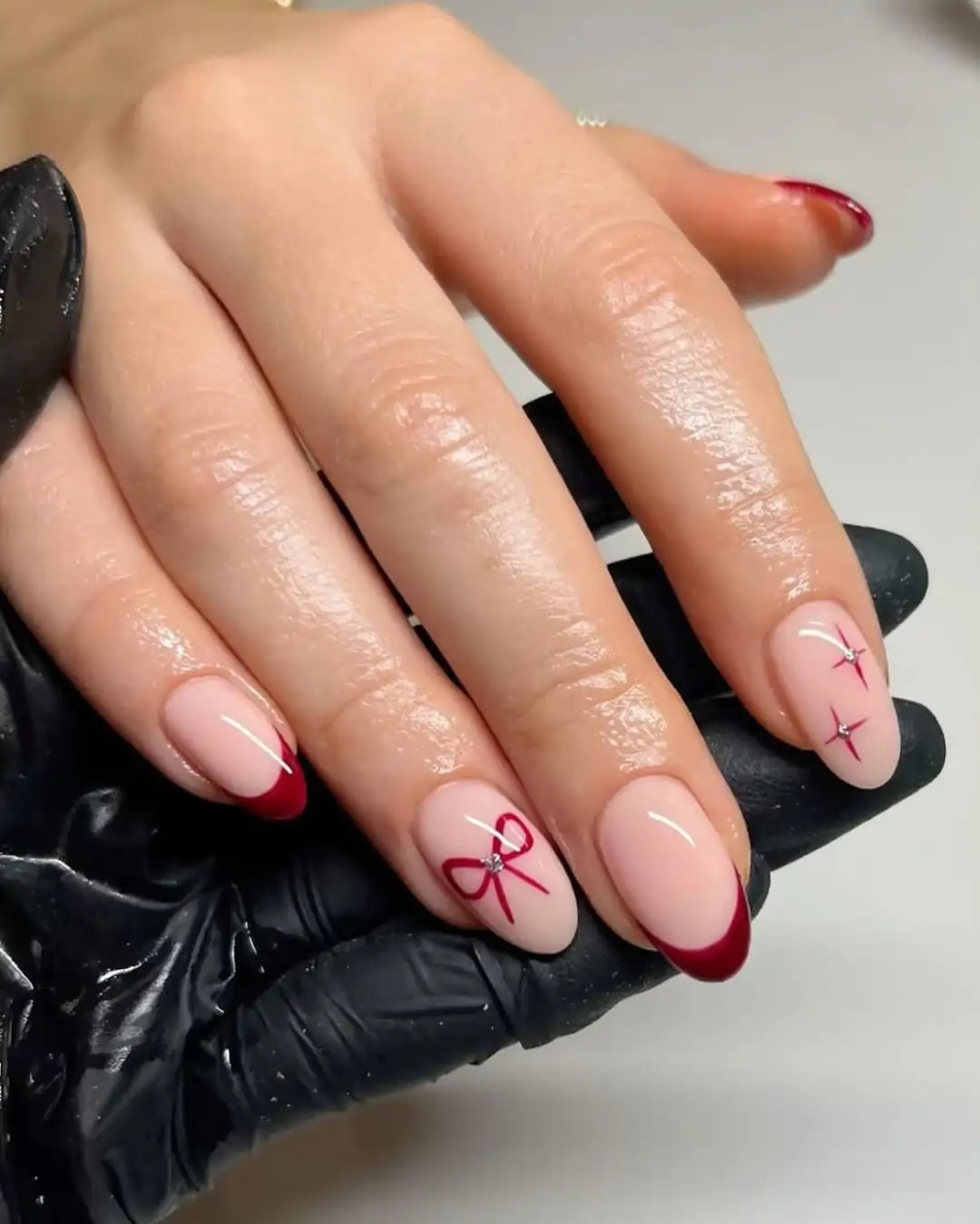 Sheer Pink Base With Red Accents Visual Idea Sheer Pink Base With Red Accents Visual Idea — Christmas Almond Nails 2026