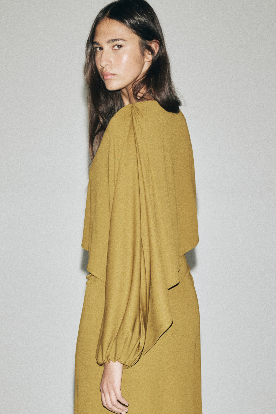 Olive Gold Crepe Dress with Draped Cape Detail Olive Gold Crepe Dress with Draped Cape Detail — Gold Dress Outfits 2027