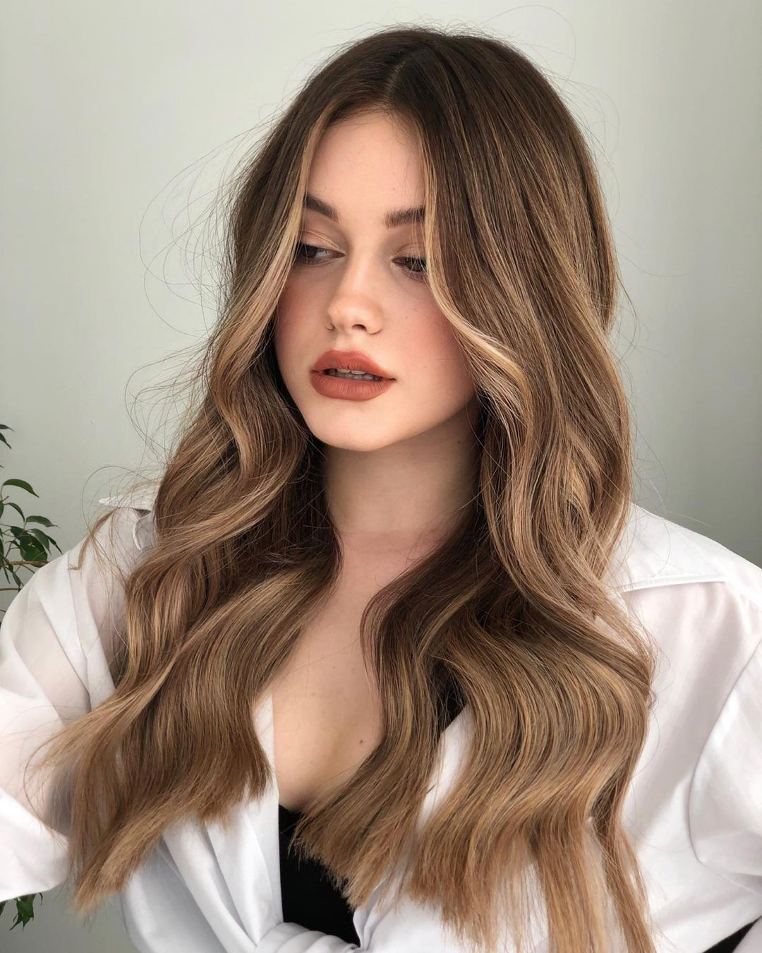 Light Brown With Subtle Blonde Balayage Collarbone Waves With Curtain Bangs Light Brown With Subtle Blonde Balayage Collarbone Waves With Curtain Bangs — Light Brown Hair 2027