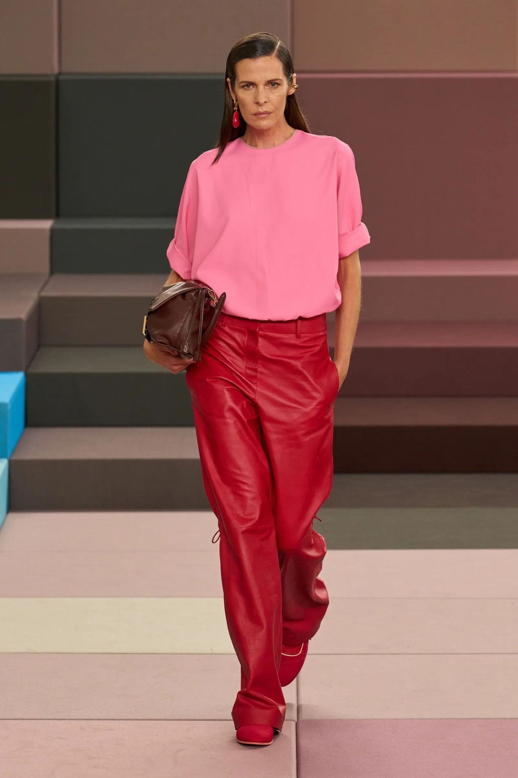 Red Leather Trousers with a Soft Pink Top on the Runway Red Leather Trousers with a Soft Pink Top on the Runway — Pink and Red Outfits 2027