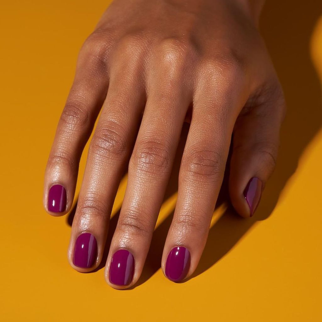 Glossy Deep Berry Purple Short Oval Nails — Nails 2027 for Brown Skin