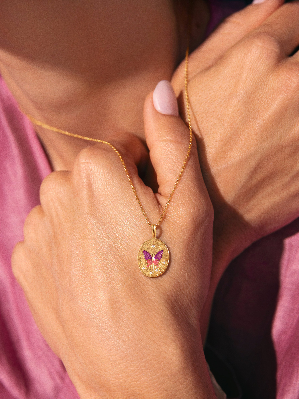 Textured Pink Top Styled with a Stone-Accent Butterfly Medallion Textured Pink Top Styled with a Stone-Accent Butterfly Medallion — Locket Necklaces 2027