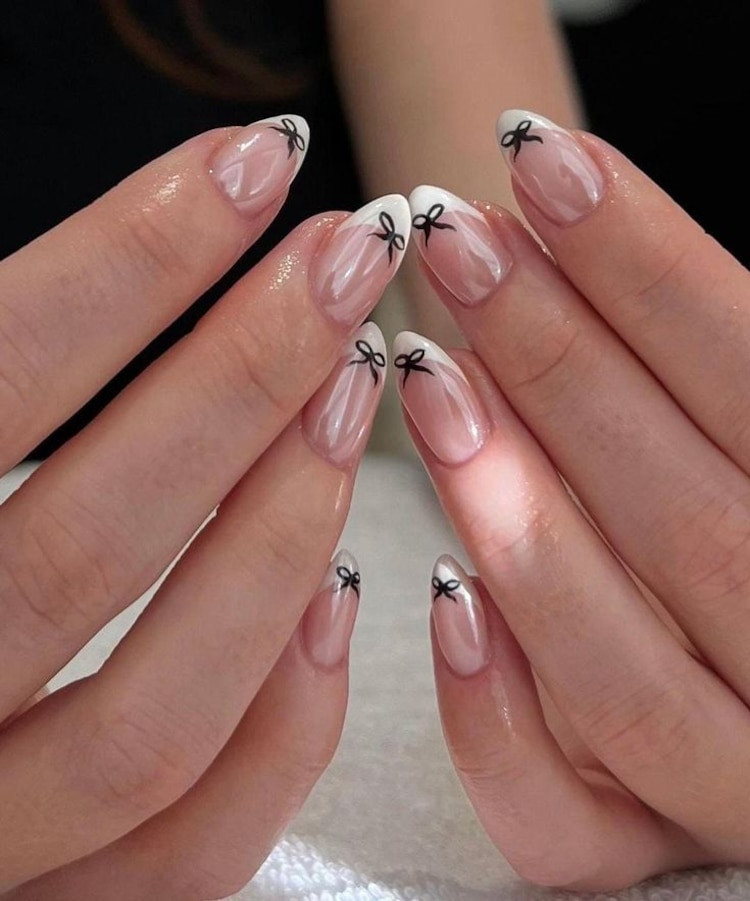 Chic Black Bows on French Tips Chic Black Bows on French Tips — Christmas Bow Nails 2026