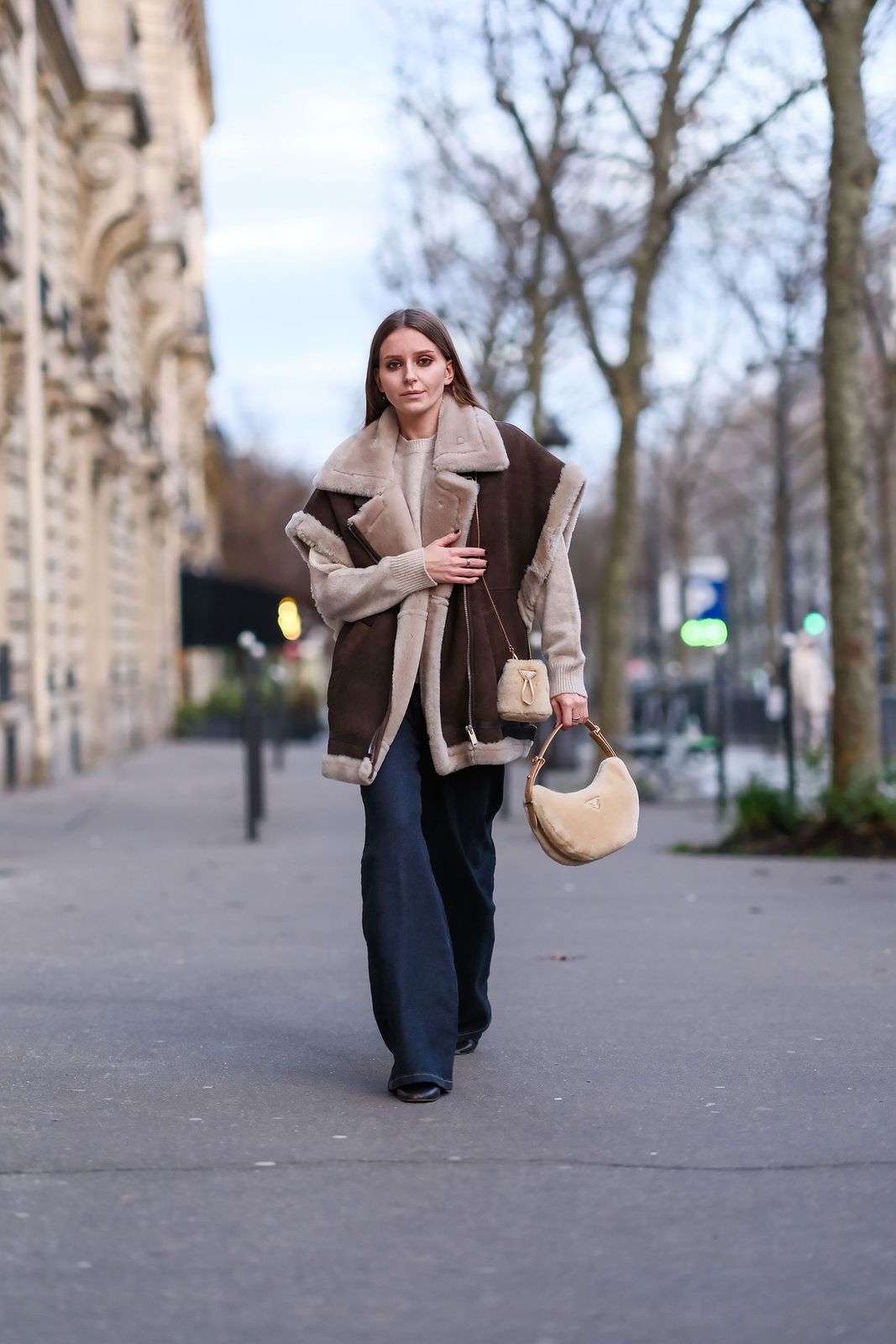Brown Shearling Vest Over Beige Sweater Brown Shearling Vest Over Beige Sweater — Vest Outfits 2027