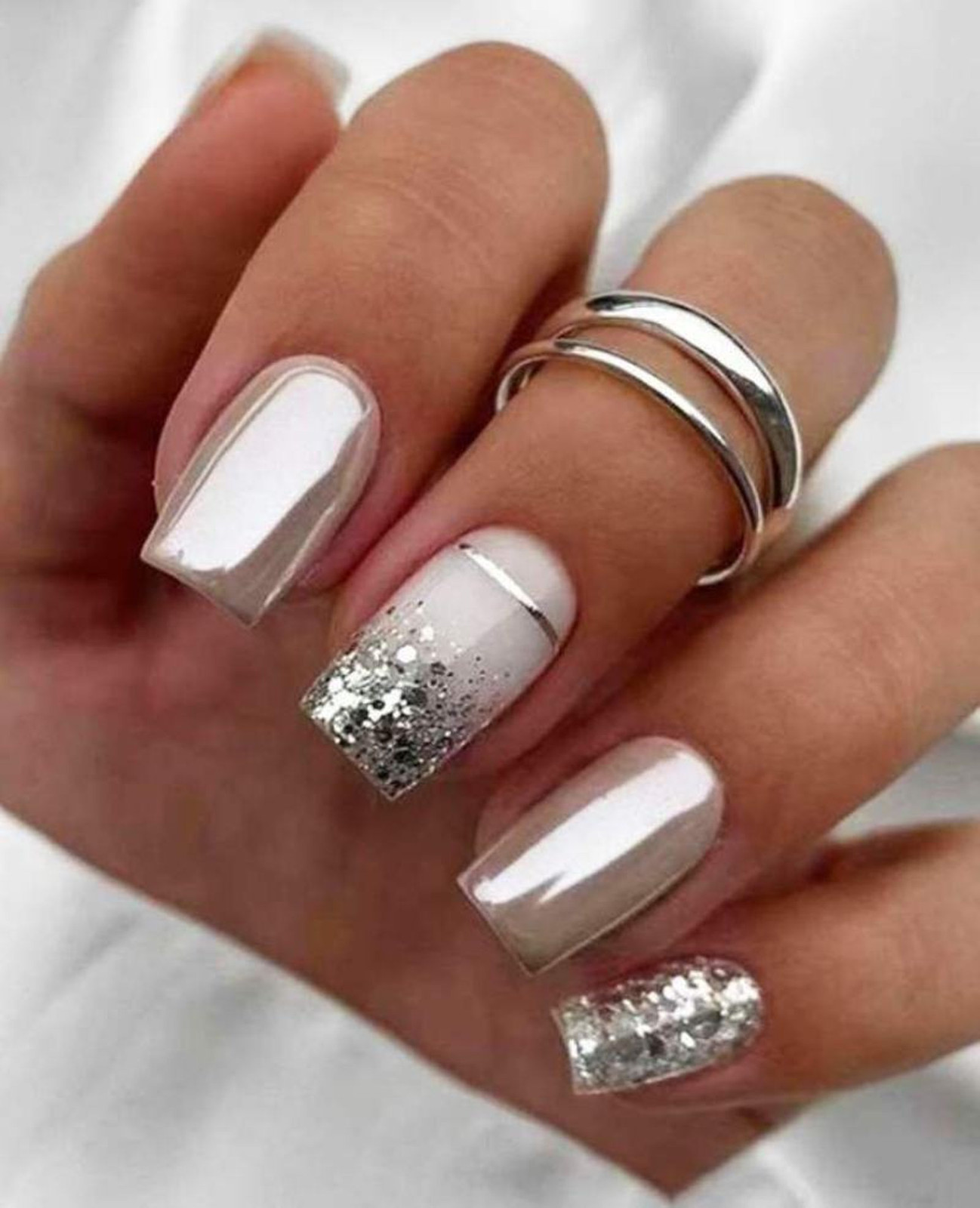 Pale Nude Chrome with Silver Glitter Accents Pale Nude Chrome with Silver Glitter Accents — Glitter Christmas Nails 2026