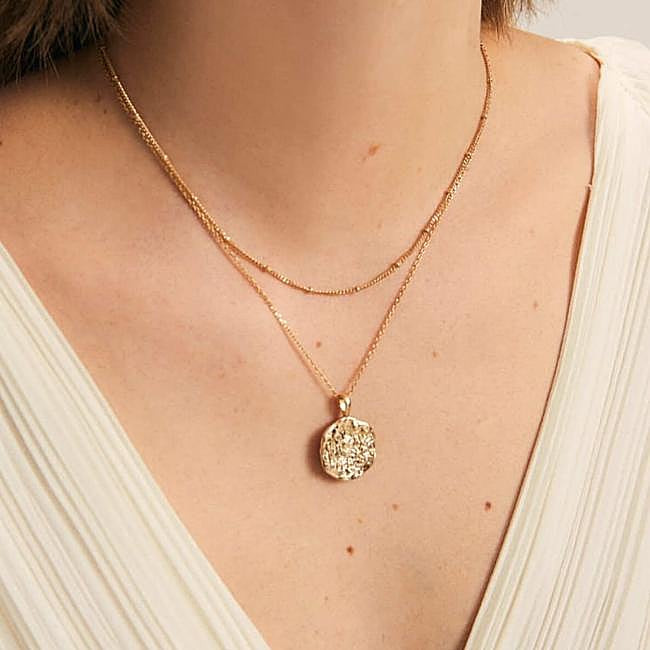 Textured Round Pendant Layered Over an Ivory Pleated Top Textured Round Pendant Layered Over an Ivory Pleated Top — Locket Necklaces 2027