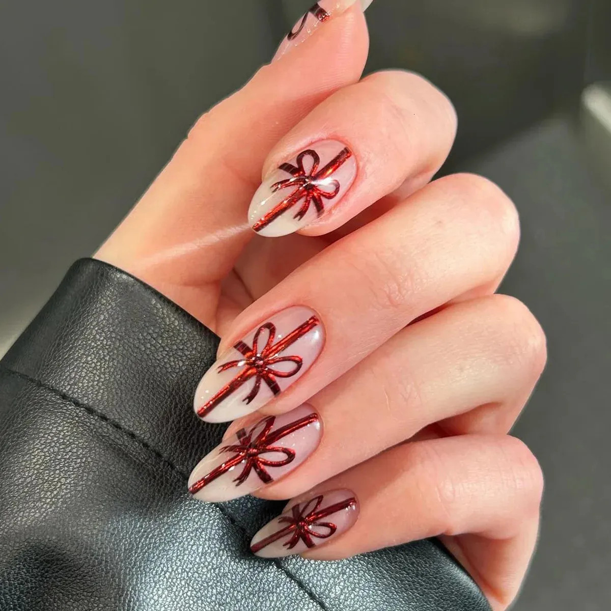 Red Glitter Bow Motif Visual Idea Red Glitter Bow Motif Visual Idea — Christmas Almond Nails 2026
