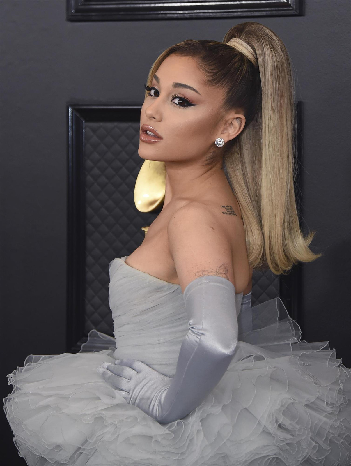 Sleek Platinum Ponytail With Dark Roots Sleek Platinum Ponytail With Dark Roots — Prom Ponytail Hairstyles 2027