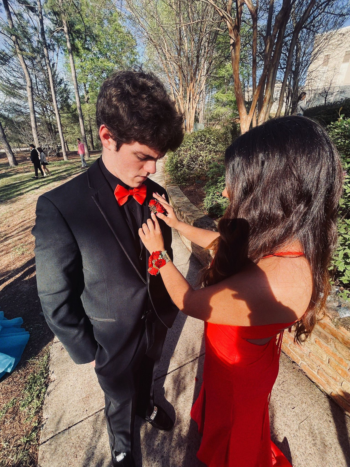 Fitted Red Dress and Black Tuxedo: A Bold Prom Combination Fitted Red Dress and Black Tuxedo: A Bold Prom Combination — Prom Couple Outfits 2027