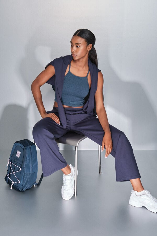 Layered Casual: Navy Wide-Leg Pants with Draped Sweater and Backpack Layered Casual: Navy Wide-Leg Pants with Draped Sweater and Backpack — Navy Blue Wide Leg Pants Outfits 2027