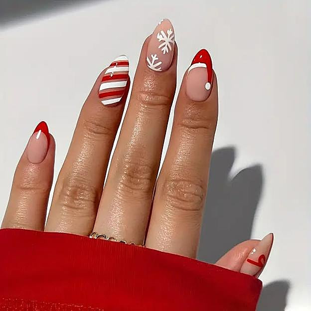 Festive Stiletto Nails with Snowflakes and Candy Canes Festive Stiletto Nails with Snowflakes and Candy Canes — Glitter Christmas Nails 2026