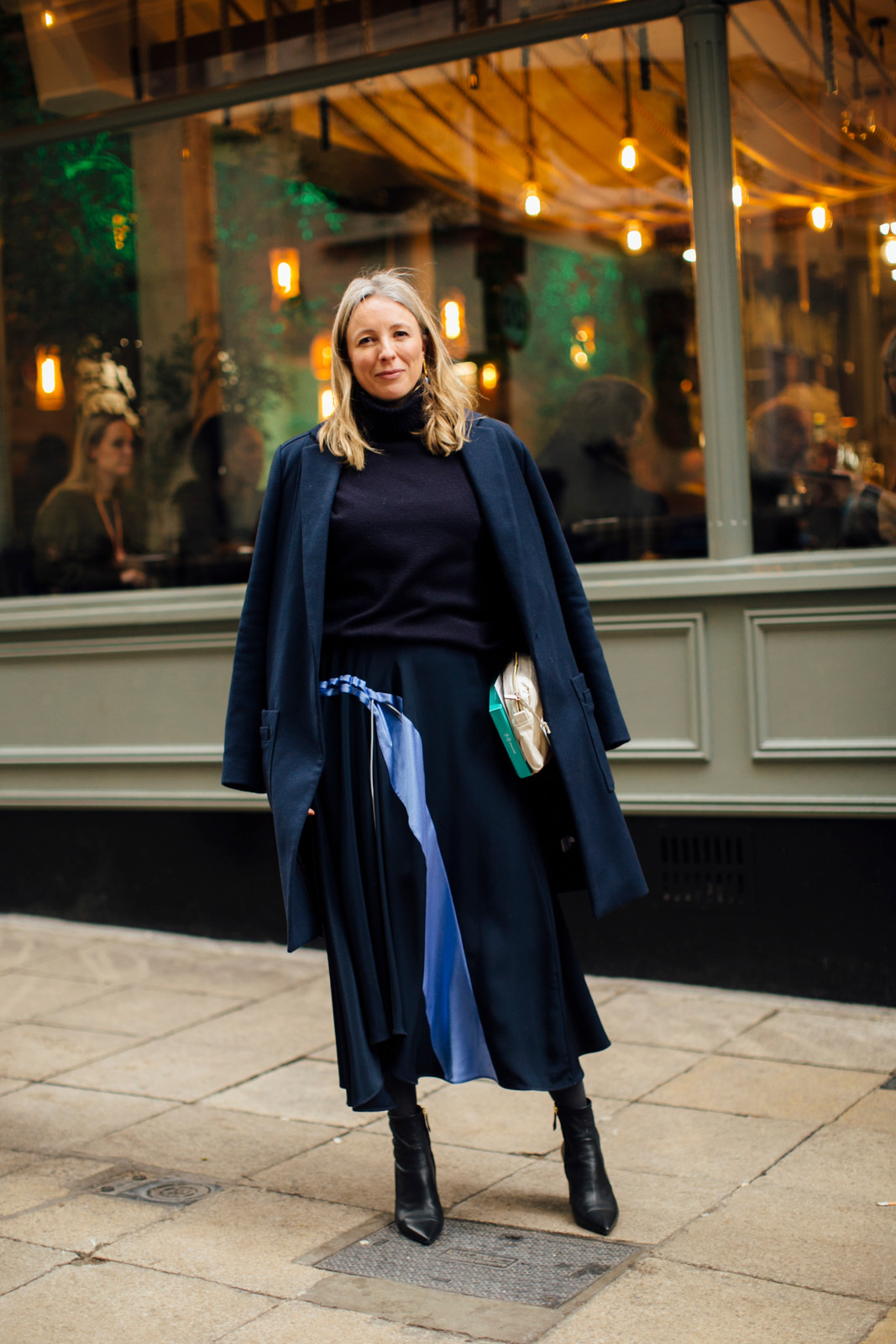 Navy Coat Over Turtleneck and Pleated Skirt Navy Coat Over Turtleneck and Pleated Skirt — Winter Navy Outfits 2027