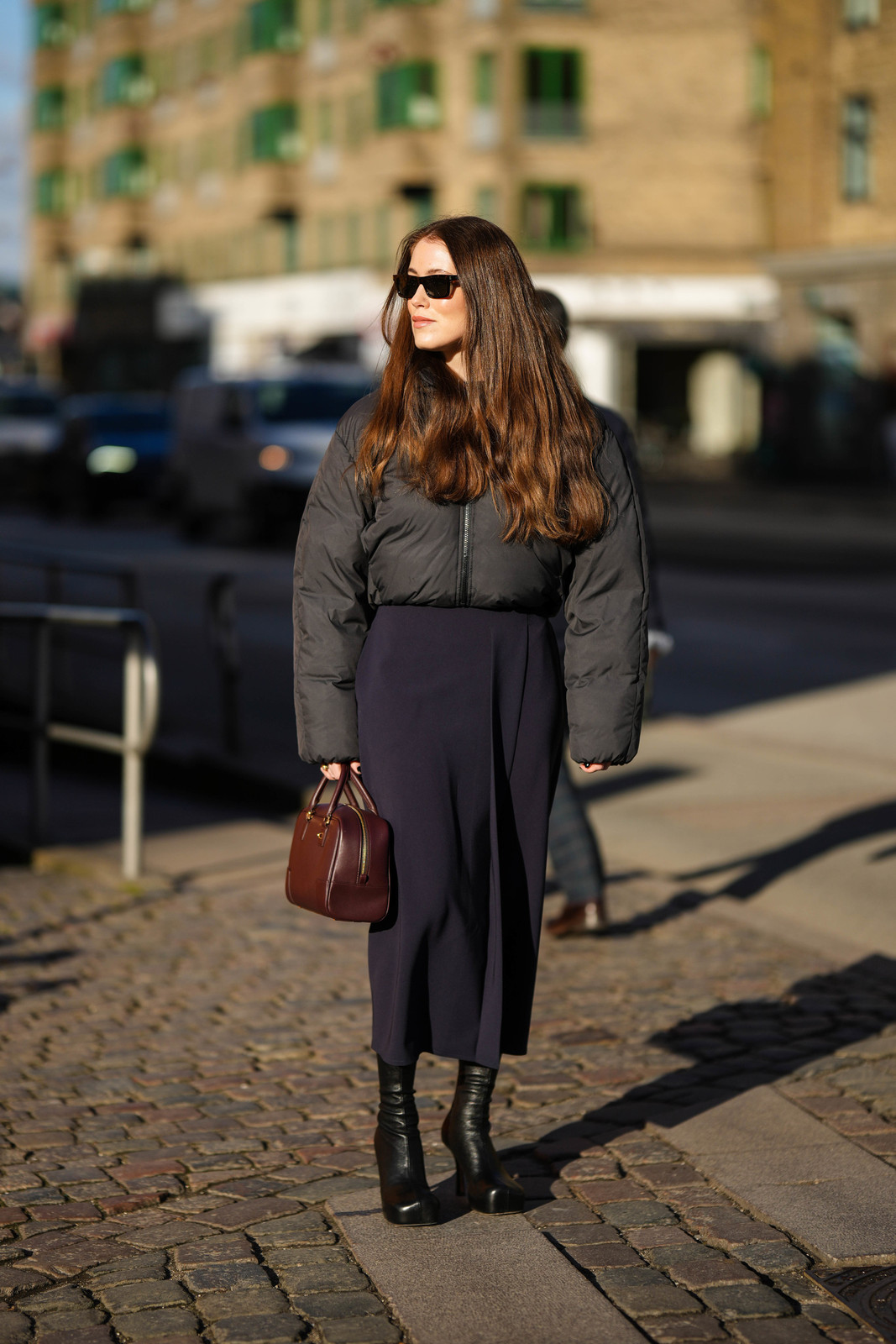 Cropped Black Puffer Jacket Over a Navy Midi Skirt for a Chic Contrast — Winter Everyday Outfits 2027