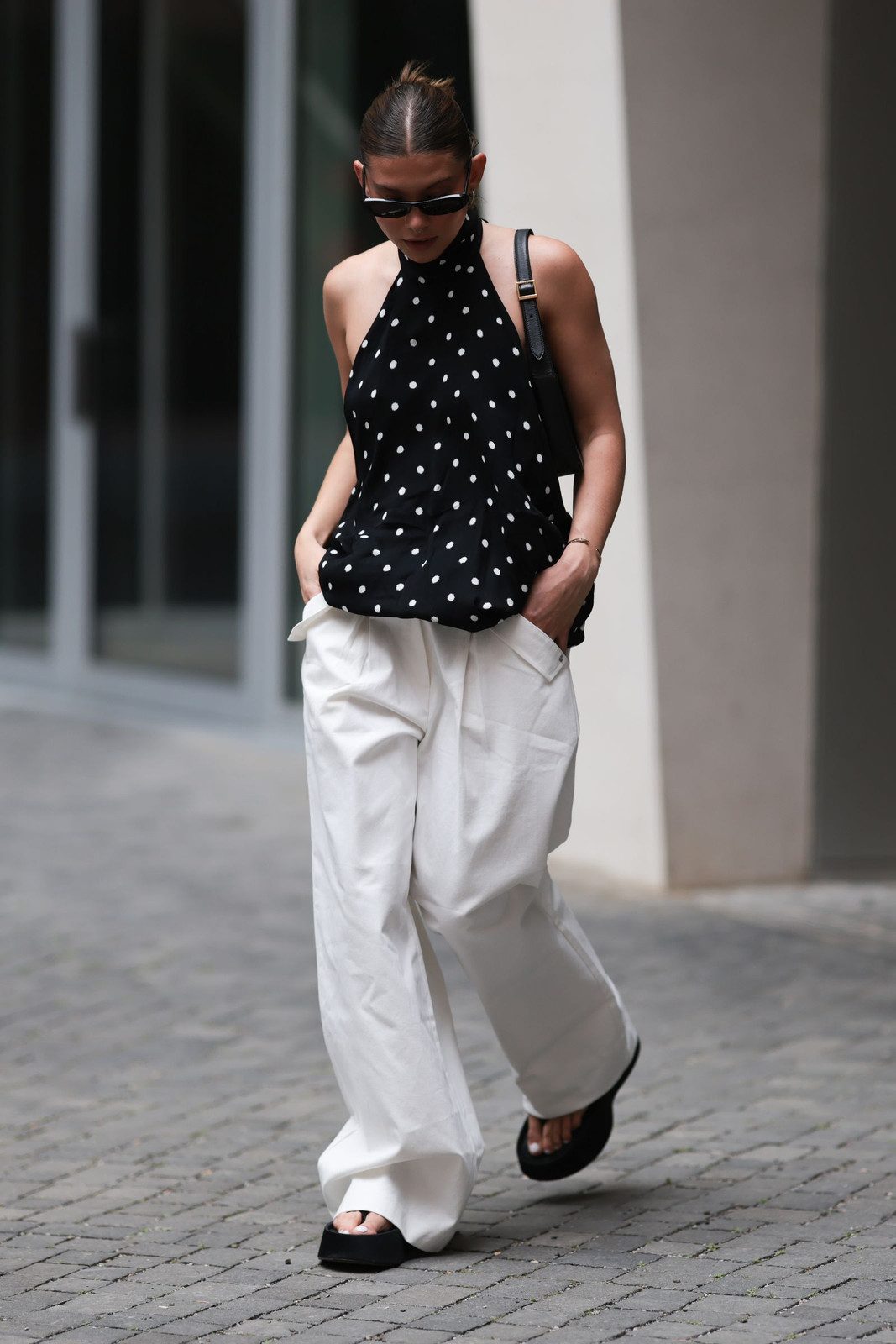 Bold Contrast: White Trousers with Black Polka Dot Halter Top Bold Contrast: White Trousers with Black Polka Dot Halter Top — White Jeans Outfits 2027