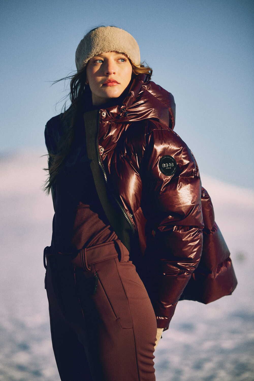 Glossy Burgundy Puffer Jacket Over Dark Red Layers Glossy Burgundy Puffer Jacket Over Dark Red Layers — Ski Outfits for Women 2027