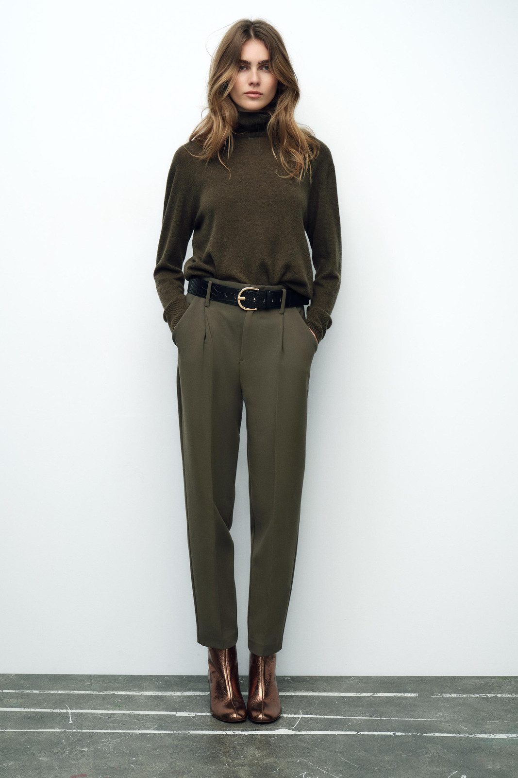 Monochrome Tailoring: Olive Green Set with Metallic Boots — Holiday Party Outfits 2026