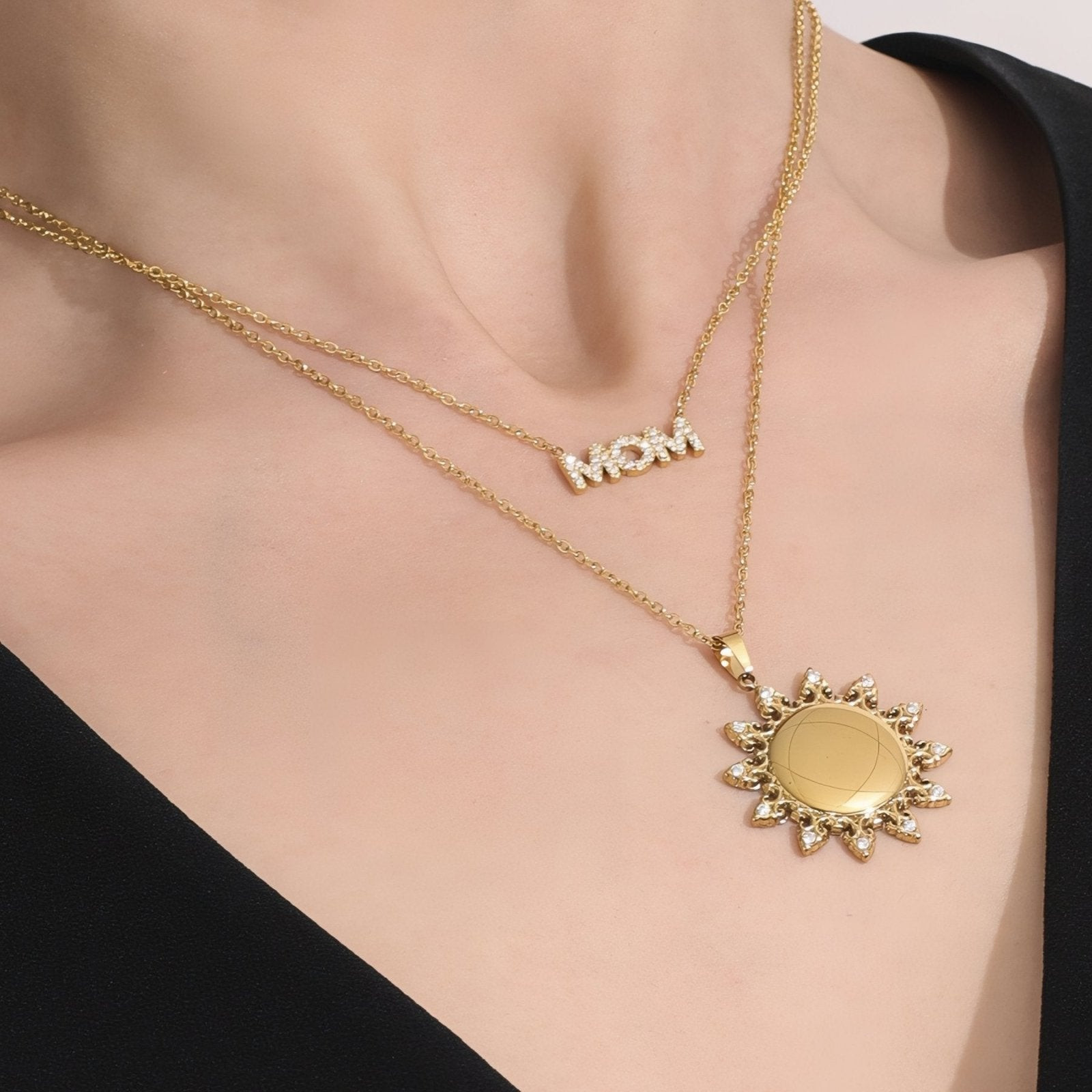 Black Knit Top Styled with 'MOM' and Sun-Shaped Locket Layers Black Knit Top Styled with 'MOM' and Sun-Shaped Locket Layers — Locket Necklaces 2027